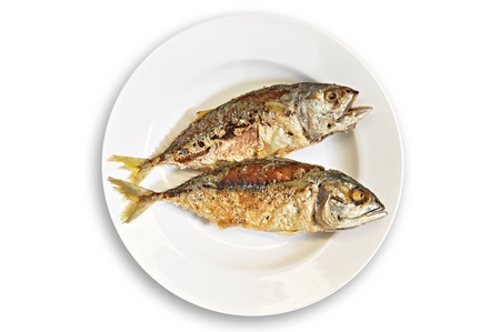 Thai style fried mackerel fish in white dishの写真素材