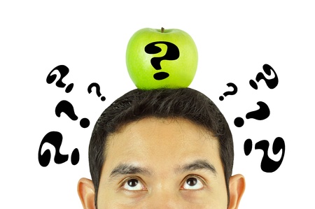 A man thinking with apple on the headの写真素材