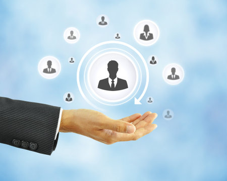 Hand holding businessman icon -  business abstract - HR conceptの写真素材