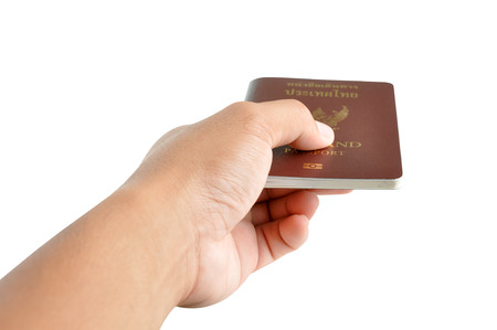 Hand holding passport  - isolated on white backgroundの写真素材