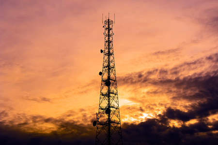 Telecom tower silhouette  in twilight sky backgroundの写真素材