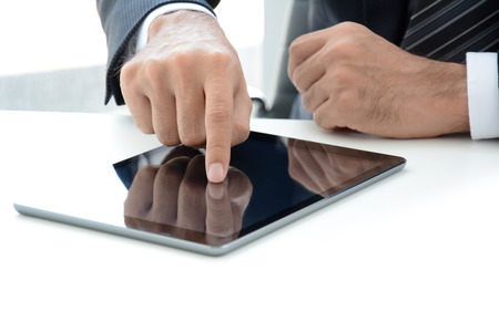 Businessman hand touching tablet computerの写真素材