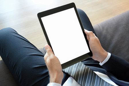 Businessman hands holding tablet pc with empty screen