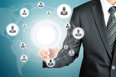 Hand pointing to businesspeople icon network on virtual screen with empty circle in the middle -can put ur texts or pictures inside Hand pointing to businesspeople icon network on virtual screen with empty circle in the middle -can put ur texts or pictures inside