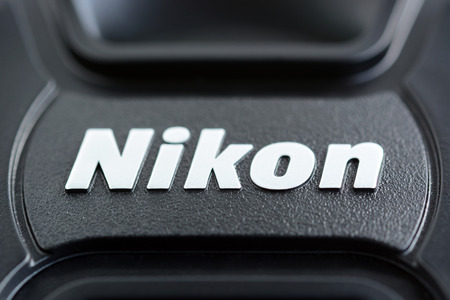 Nikon brand logo on lens cover or lens cap. Nikon is one of poppular brand of imaging products headquartered in Tokyo Japanのeditorial素材