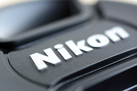Nikon brand logo on lens cover or lens cap. Nikon is one of poppular brand of imaging products headquartered in Tokyo Japanのeditorial素材