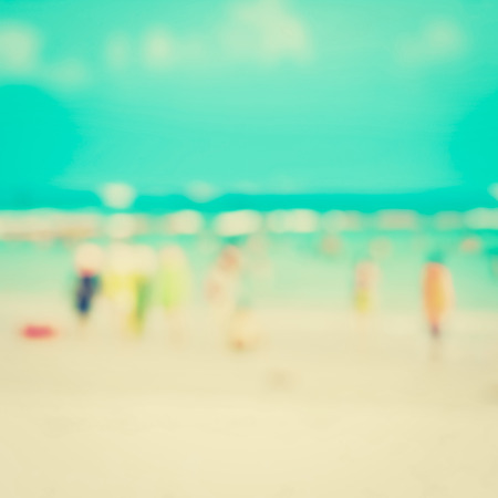 Blurred people at the beach - vintage toneの写真素材