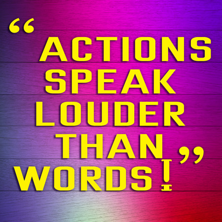 ACTIONS SPEAK LOUDER THAN WORDS message on colorful backgroundの写真素材