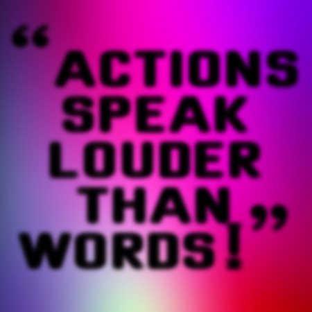ACTIONS SPEAK LOUDER THAN WORDS blurred message on colorful backgroundの写真素材