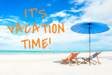 IT'S VACATION TIME message on blurred beach backgroundの写真素材