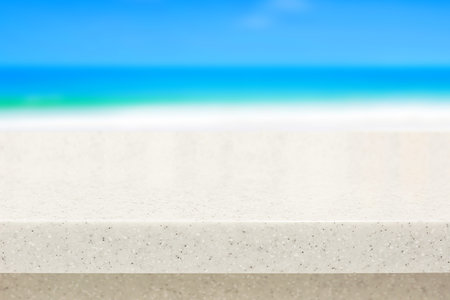 White stone countertop on blurred beach background - can be used for display or montage your...