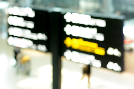 Blur image of airport direction signs in airport terminalの写真素材