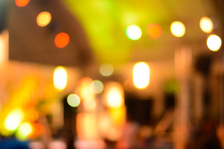 Abstract colorful bokeh at night for background, yellow theme
