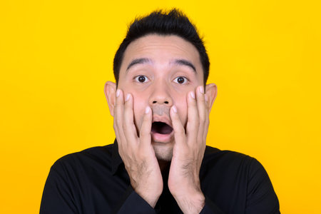 A man expressing shocked and scared face, feeling and emotion concept