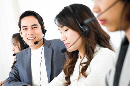 Call center ( telemarketer or operator) team - customer service and telemarketing conceptsの写真素材