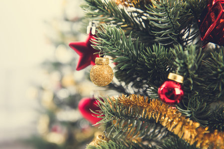 Shiny and glittering decorative ornaments on Christmas treeの写真素材