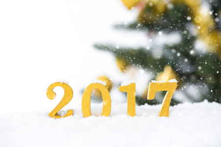Golden 2017 figures in snowfall, Christmas and new year concepts