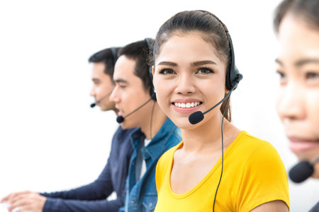 Smiling woman in casual clothes working in call center
