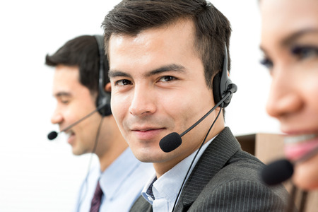 Handsome call center staff (or telemarketer)の写真素材