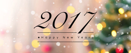 2017 Happy New Year text on abstract colorful bokeh banner background