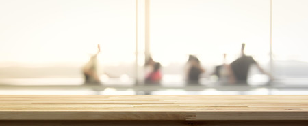 Wood table top on blur people in airport terminal background, panoramic banner - can be used to display or montage your productsの写真素材