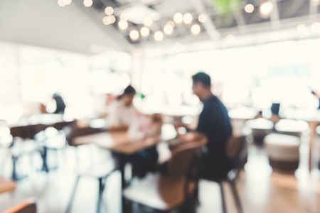 Blur restaurant (cafe) interior with people - abstract backgroundの写真素材