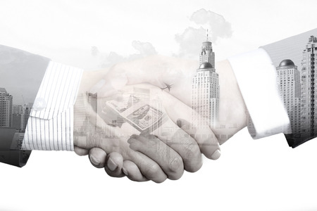 Handshake of businessmen on white background, double exposure effect - partnership, merger and acquisition conceptsの写真素材
