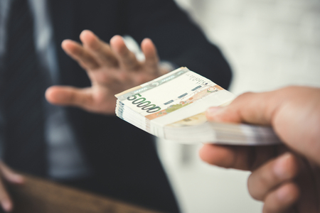 Businessman refusing money, South Korean won bills - anti bribery and corruption conceptsの写真素材