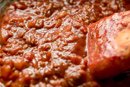 Homemade delicious Italian bolognese spaghetti sauce with beef minced meat being cooked in the panの写真素材