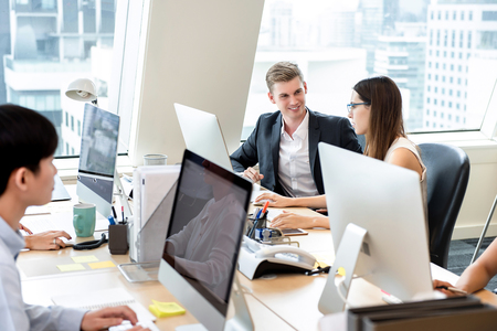 Group of business people coworkers working in office space on high rise building in the cityの写真素材