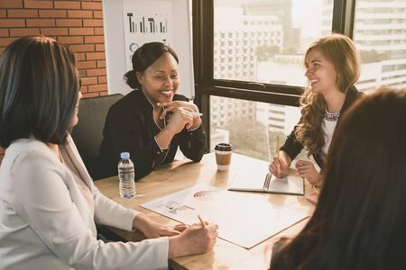 Happy diverse businesswoman leaders in meeting roomの写真素材