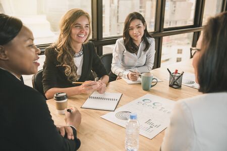 Japanese businesswoman having a meeting with international team, diverse female leader conceptの写真素材