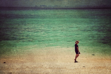 Young woman standing on a beach,Vintage styleの写真素材
