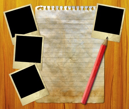 Frame with old paper and photos,over woodenの写真素材