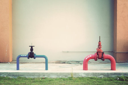 Vintage hydrant with water hoses and fire extinguish equipment