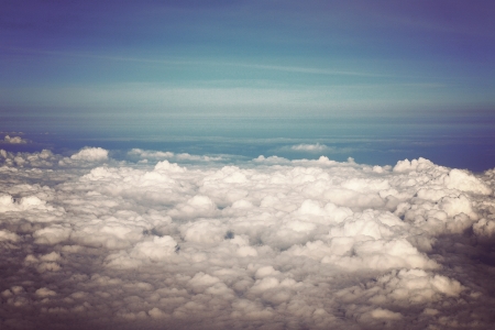 View above the earth at the clouds belowの写真素材