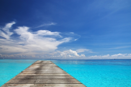 Sea and wooden walkway in summerの写真素材