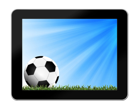 Football in green grass with background in tablet-pcの写真素材