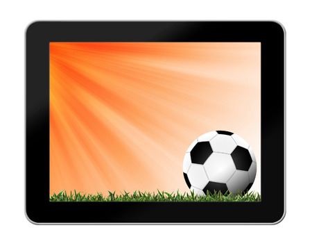 Football in green grass with background in tablet-pcの写真素材