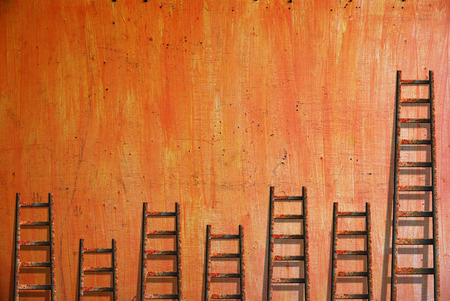 Old red wall damaged paintの写真素材