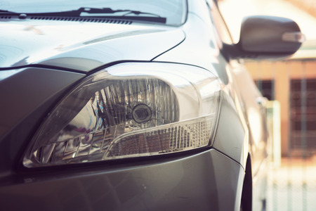 Selective focus point on Headlight lamp car, Vintage filterの写真素材