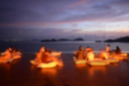 Abstract blur people watching sunset, beach partyの写真素材