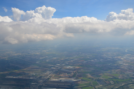 View from the window of an airplane flying in the cloudsの写真素材