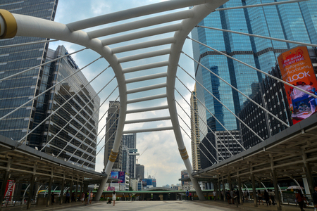 BANGKOK, THAILAND - October 25, 2018 - High buildings and public skywalk for transit between Chong Nonsi Bts Station with Sathorn junction  business area center.のeditorial素材