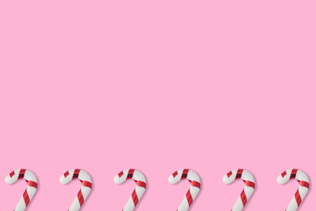 Christmas candies cane pattern on pink background, for New Year and Christmas background.の写真素材