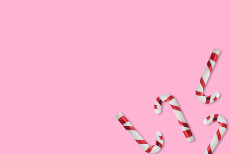 Christmas candies cane pattern on pink background, for New Year and Christmas background.の写真素材
