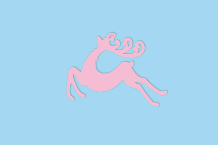 Pink Reindeer on blue background with copy space, New year, Christmas Conceptの写真素材