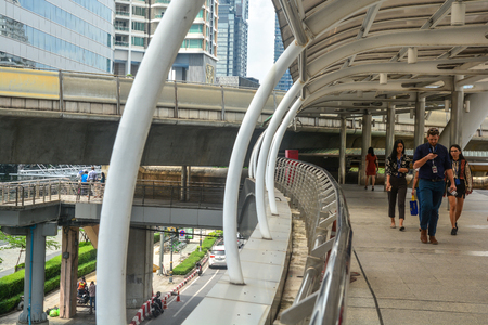 BANGKOK, THAILAND, October 25, 2018 - Business colleagues walking in a modern city, Sathorn, Bangkokのeditorial素材