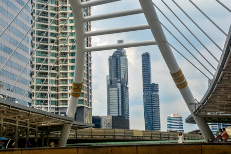 BANGKOK, THAILAND - October 25, 2018 - High buildings and public skywalk for transit between Chong Nonsi Bts Station with Sathorn junction  business area center.のeditorial素材