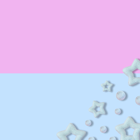 Christmas pastel pink and blue background with glitter star, New Year greeting card, minimal conceptの写真素材